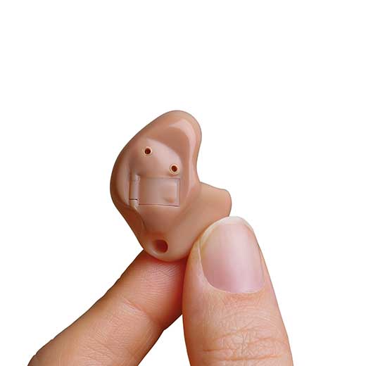 ITE hearing aid in hand